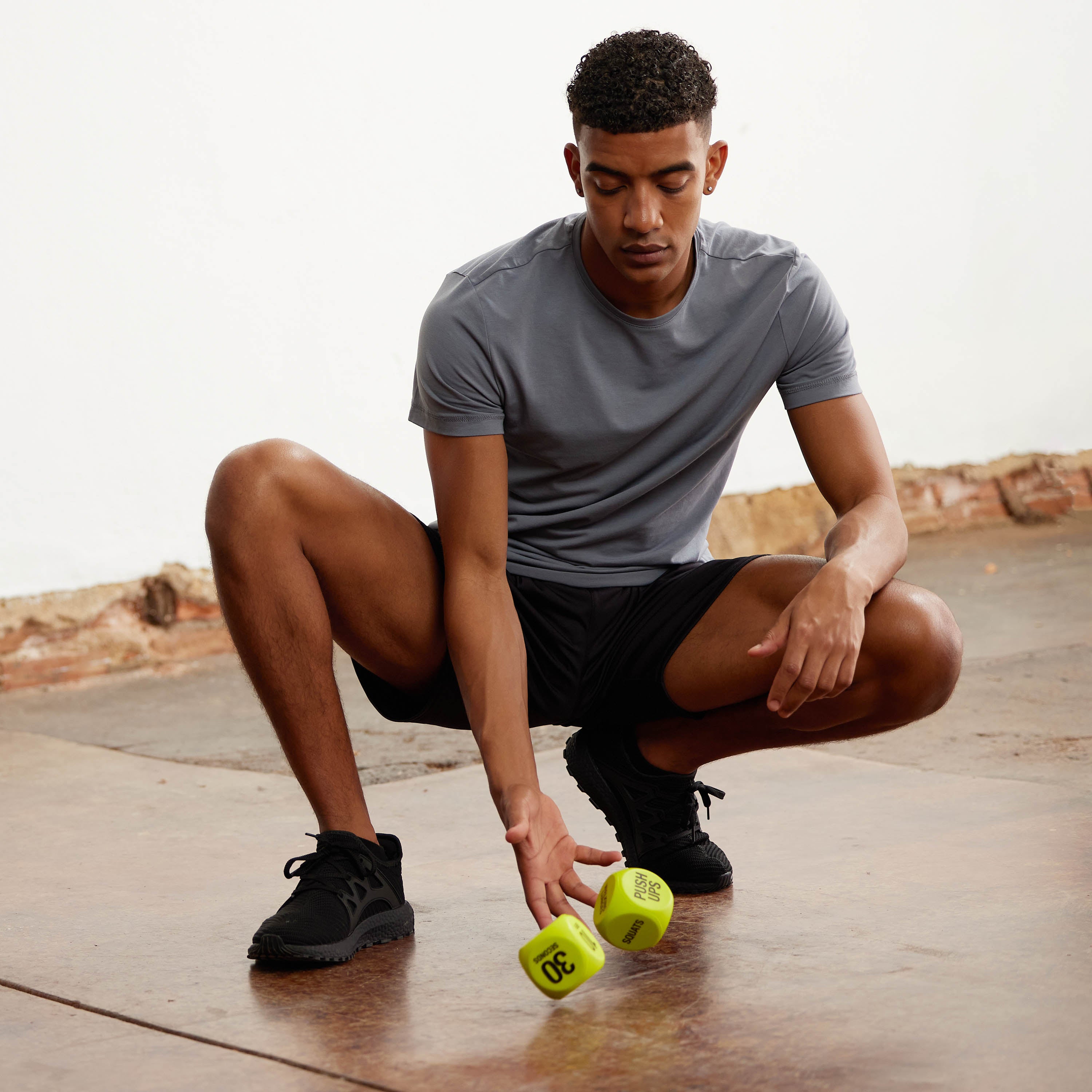 Person rolling the Exercise Dice