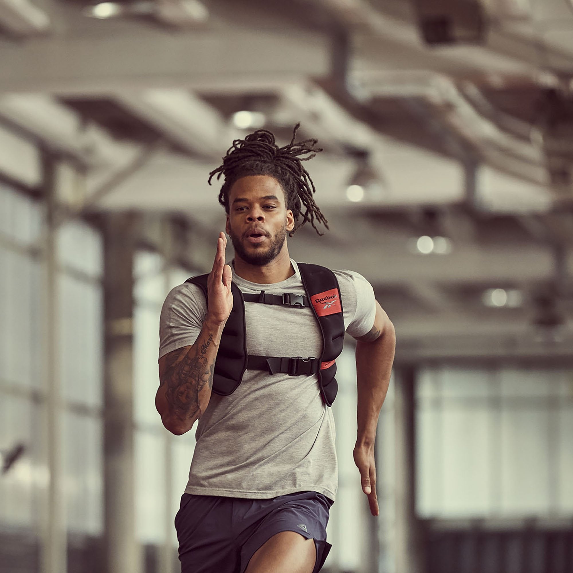 Reebok Strength Series Weight Vest front on man sprinting